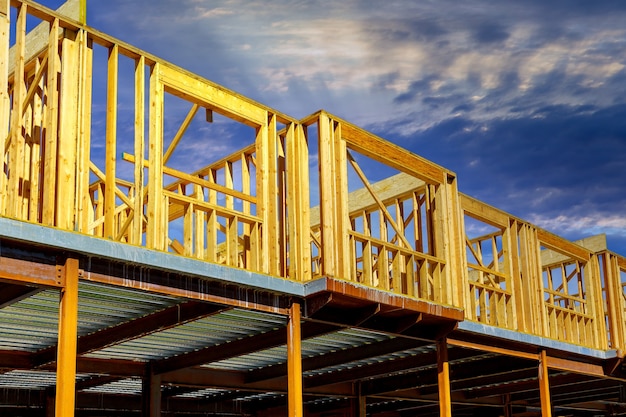 Aerial view of unfinished house with wooden beam house construction development