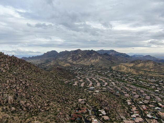 Aerial view of upscale luxury homes with dry landscape mountain and desert in Scottsdale Phoenix