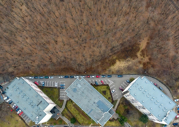 Photo aerial view of urban environment expansion against nature expanding flat of blocks occupy forest