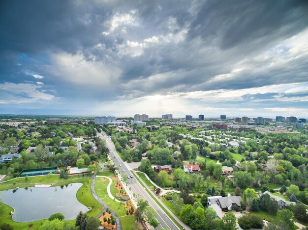 Aerial view of urban park with lake.