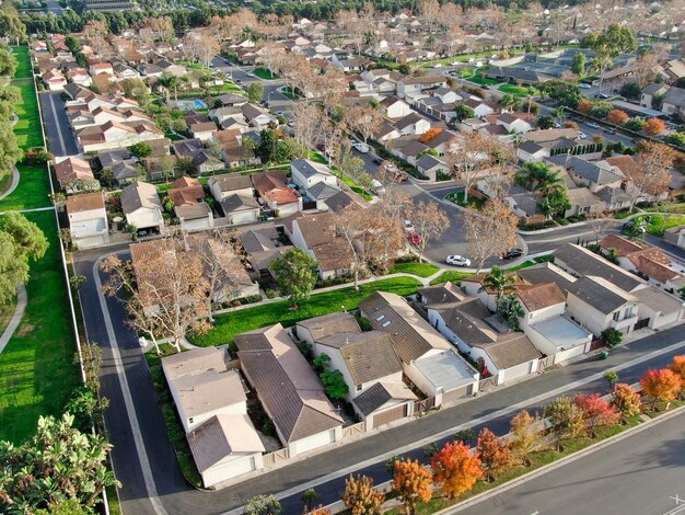 Aerial view of urban sprawl Suburban packed homes neighborhood with road