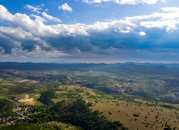 Photo aerial view of a valley with beautiful blue sky and clouds