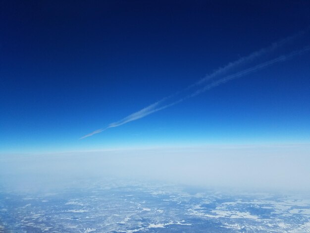 Aerial view of vapor trail in sky