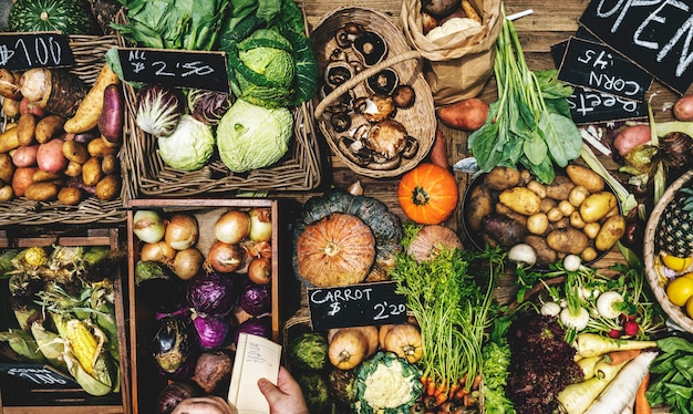 Aerial view of various fresh organic vegetable on wooden table