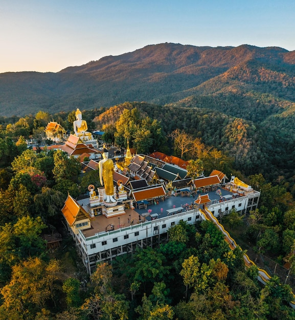 Aerial view of Wat Phrathat Doi Kham, Buddha pagoda and golden chedi in Chiang Mai, Thailand