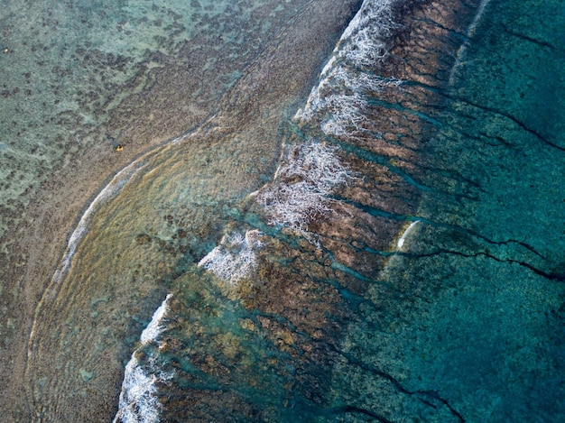 Aerial view of waves on reef of polynesia Cook islands