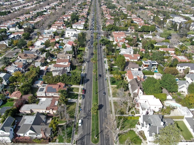 Aerial view of wealthy area with big houses and small street in Central Los Angeles California