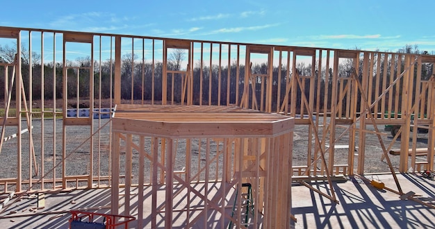 Aerial view of wood framework under construction on new wooden house