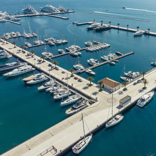 Photo aerial view of yachts in city docks of montenegro