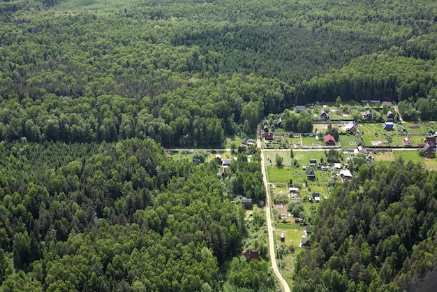 Aerial Views Russian village in the mixed coniferous forest