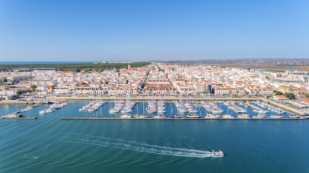 Photo aerial. village vila real sto antonio on the river guadiana, with a port for yachts and fishing boats.