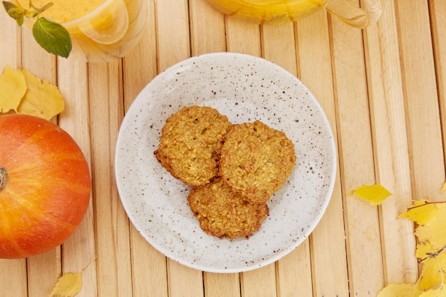 Aesthetic homemade vegan pumpkin cookies with healthy sea buckthorn tea Vegan breakfast at the terrace Natural increased immunity natural tea