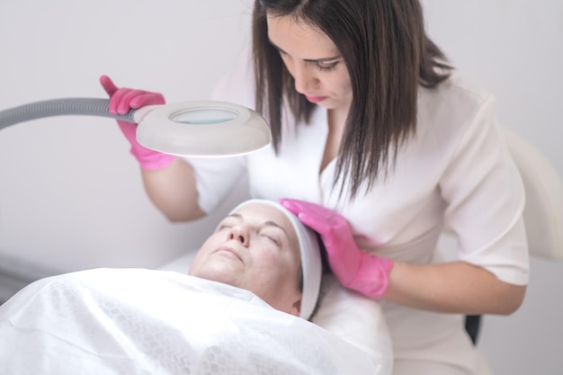 Aesthetic medicine clinic beautician facial procedures peeling and lifting massages