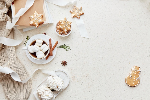Aesthetics Christmas background with cup of hot drink marshmallows ginger snowflakes cookies
