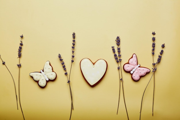 Aesthetics spring cookies among lavender Spring card top view Baked glazed symbols of Easter