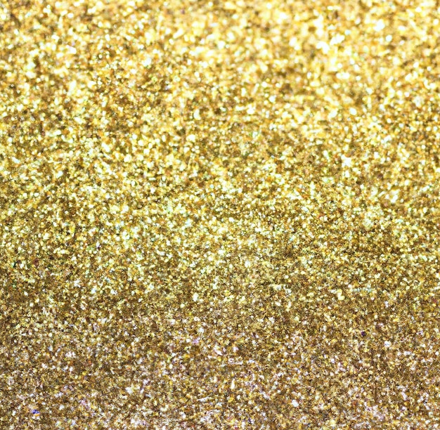 Afbeelding van close-up van goud glitter deeltjes achtergrond met kopie ruimte