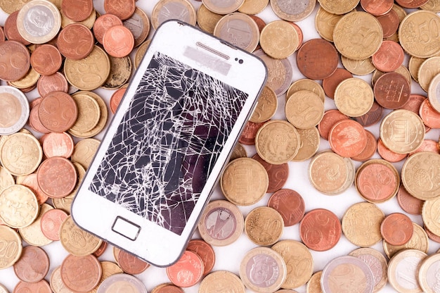 Foto afbeelding van een business money concept idee, smartphone en munten