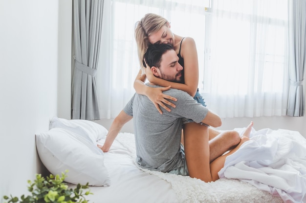 affectionate young couple on bed