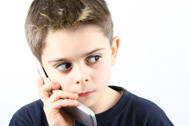 Afraid little boy speaking on the phone