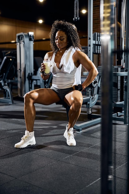 African American bodybuilder holding a healthy beverage