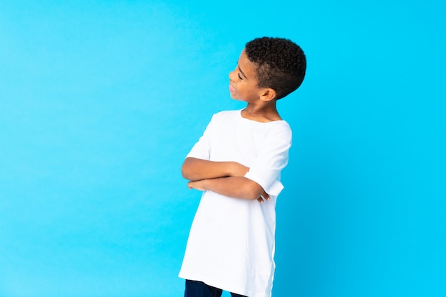 African American boy over isolated bluelooking side