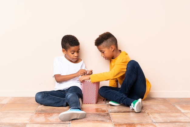 African American brothers  holding popcorns