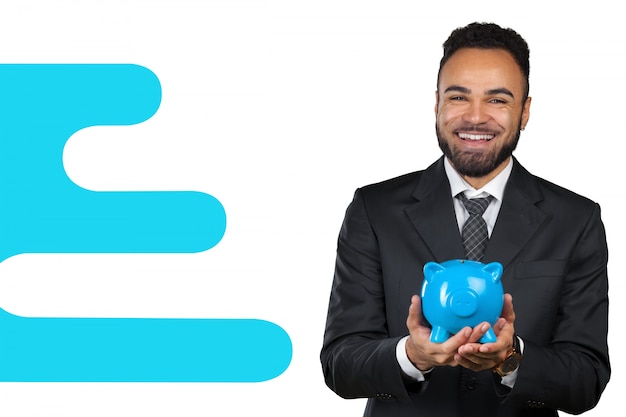 African American business man holding a piggy bank