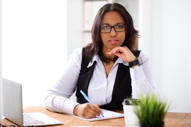 African american business woman is busy with paper job in office