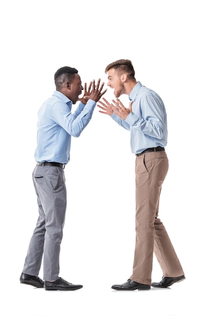 African-American businessman and a Caucasian businessman arguing on white