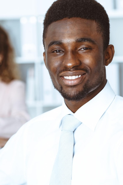 African american businessman at meeting in office, colored in white. Multi ethnic business people group.