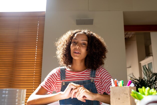 African american businesswoman smiling talking having video call, looking at camera