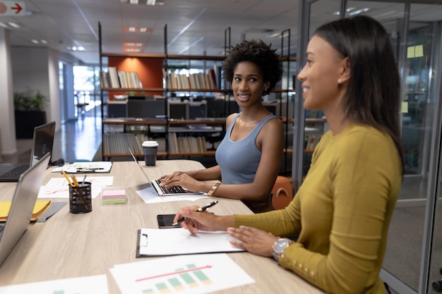 African american businesswomen working together in modern workplace