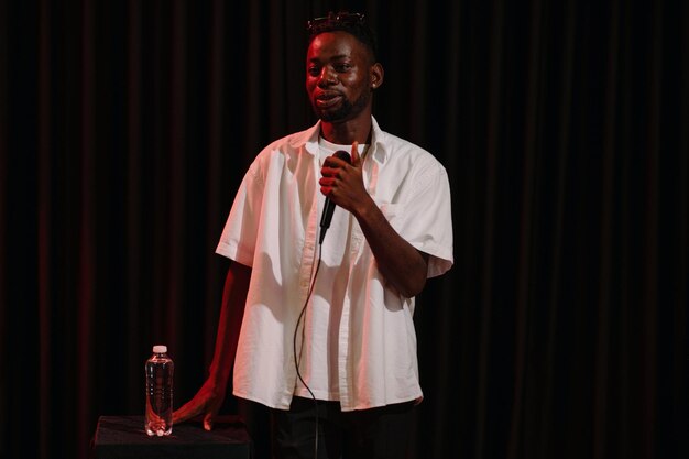 african american comedian performing standup routine