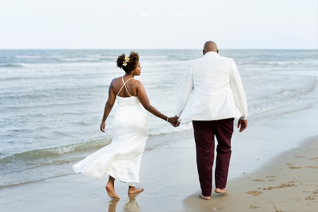 African American couple getting married at an island