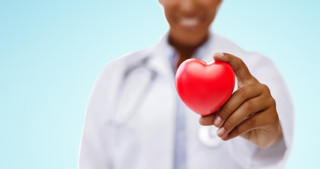 african american doctor hand holding red heart