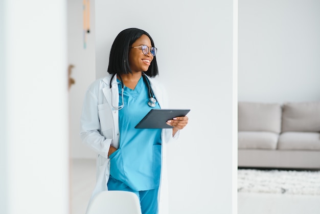 African American doctor working in her office at clinic