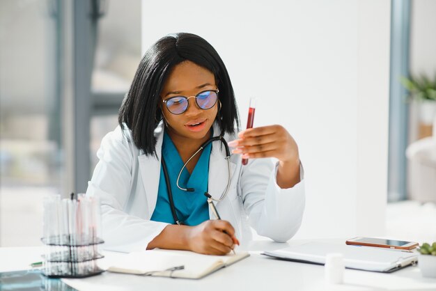 African American doctor working in her office at clinic