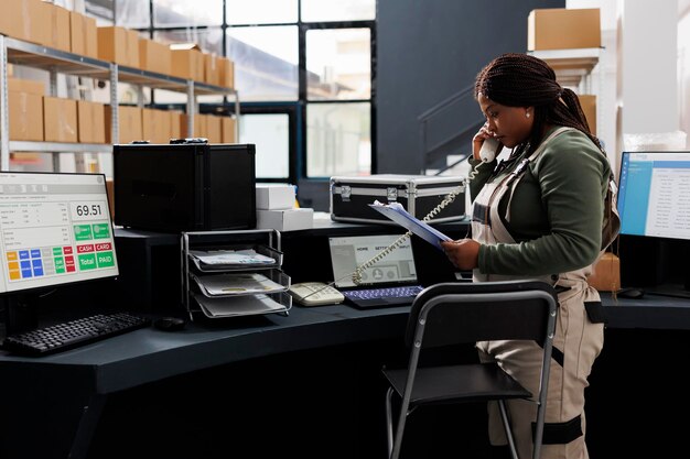 African american employee holding clipboard