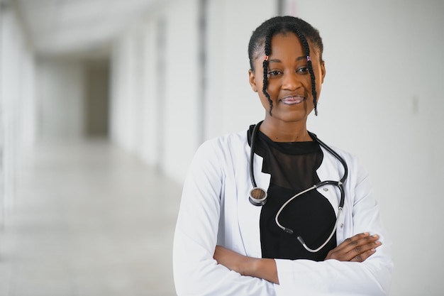 African american female doctor in hospital corridor