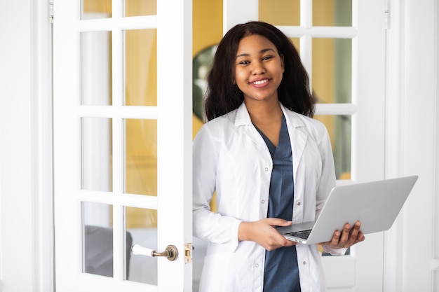 An african american female doctor provides telemedicine consultations through the transmission of medical information via telecommunications channels high quality k footage