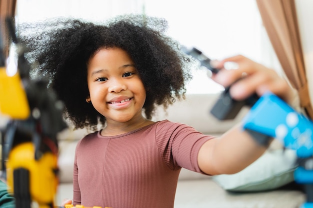 African american girl learning robotic and a program computer innovative technology