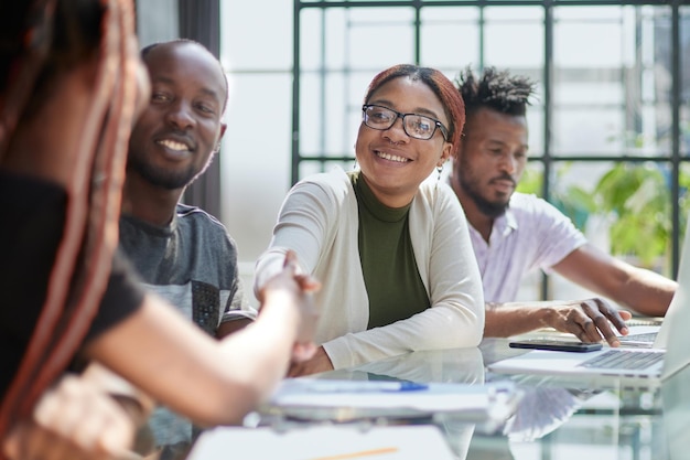 African american hr team welcoming female applicant at job interview