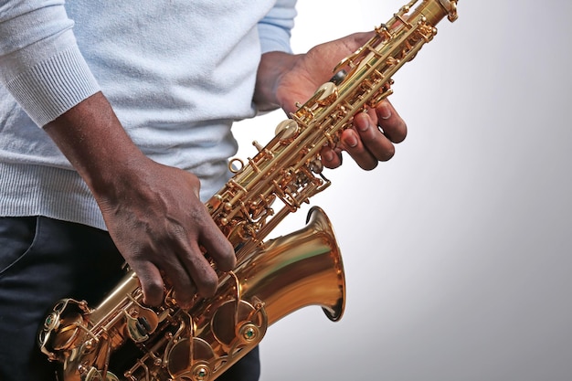 african american jazz musician playing the saxophone closeup