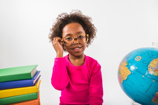 African-American kid in glasses in studio