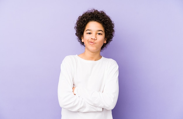 African american little boy isolated frowning face in displeasure, keeps arms folded.