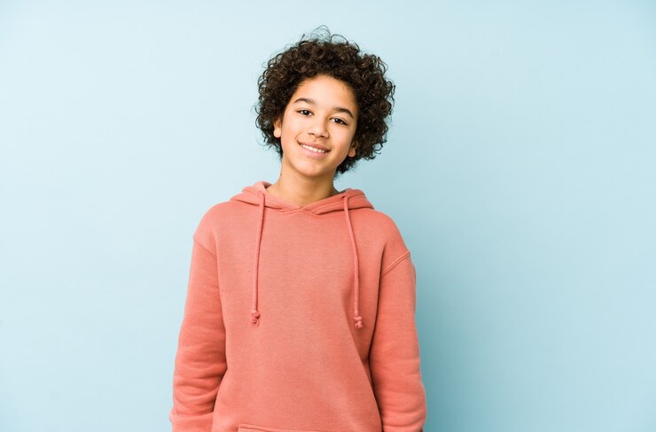 Photo african american little boy isolated happy, smiling and cheerful.