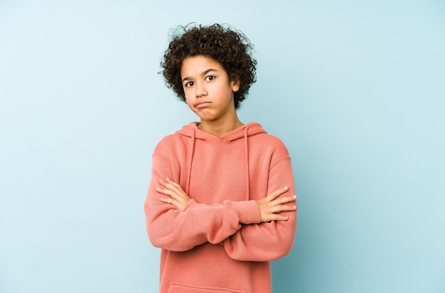 African american little boy isolated unhappy with sarcastic expression.