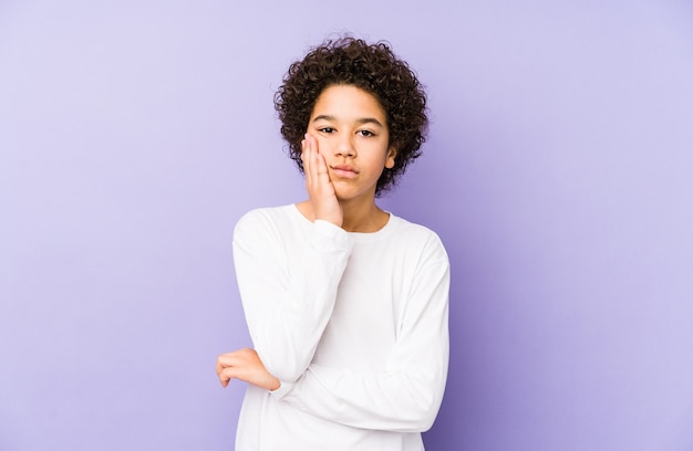 African american little boy isolated who is bored, fatigued and need a relax day.