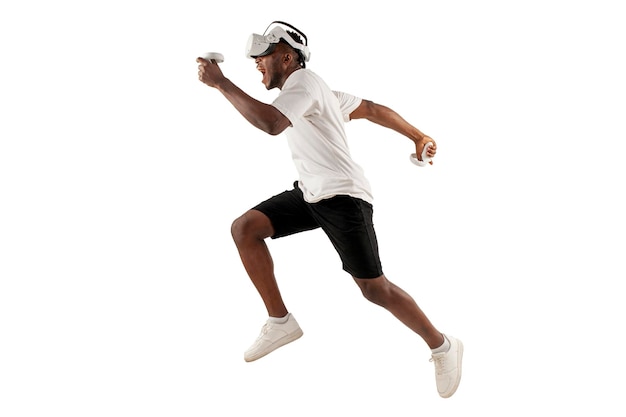 African american male athlete runs forward and plays in virtual reality glasses on white background