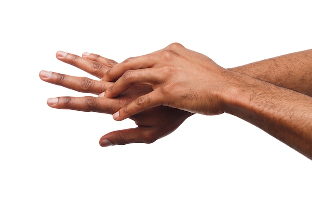 Photo african-american male hands rubbimg together, applying moisturizing cream at white isolated background. male cosmetology and skin care